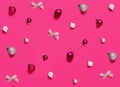 Christmas decorations and baubles on a pink background