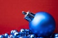 Christmas Decorations. Beautiful blue Christmas Ball on Red Royalty Free Stock Photo