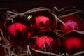Christmas decorations in a beautiful box, red balls in the snow. Christmas decor Royalty Free Stock Photo