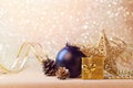 Christmas decorations in black and gold over glitter background Royalty Free Stock Photo