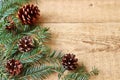 Christmas decorations - branches of coniferous trees with decorations on a wooden background