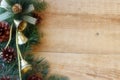 Christmas decorations - branches of coniferous trees with decorations on a wooden background