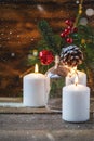 Christmas decorations, burning candles, snowflakes, spruce on a wooden background. New Year`s concept. Postcard Royalty Free Stock Photo
