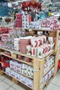 Christmas decorations, ceramic cups, glasses and balls, sells on a shop counter. Festive shopping in mall