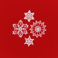 Christmas decorations. Composition from crocheted snowflakes isolated on red. Winter or Christmas background. square