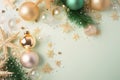 Christmas decorations concept. Top view photo of pine branches in the snow with gold-green transparent baubles star ornaments and Royalty Free Stock Photo