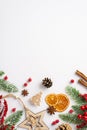 Christmas decorations concept. Top view vertical photo of wooden star ornament dried orange slices cinnamon sticks mistletoe