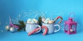 Christmas decorations, a couple of cups of coffee with meringues on a blue background