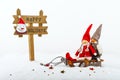 Christmas decorations: dolls on sleds and signboard Royalty Free Stock Photo