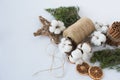 Christmas decorations eco cotton flowers, cinnamon,stars, spruce branches and jute rope hank over white background,holiday,xmas,ch Royalty Free Stock Photo