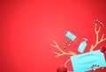 Christmas decorations with face mask, alcohol gel, ball, candy, reindeer antler isolate on red background, party  during Covid-19 Royalty Free Stock Photo