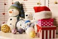 Christmas decorations in festive room. Snowmen and teddy bears, Royalty Free Stock Photo