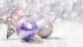 Christmas decorations with fir tree branch on wooden background with snow, blurred, sparking, glowing and text Merry Christmas Royalty Free Stock Photo