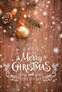 Christmas decorations with fir tree branch on wooden background with snow, blurred, sparking Royalty Free Stock Photo