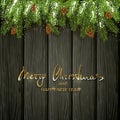 Christmas decorations with fir tree branches and snow on black wooden background Royalty Free Stock Photo