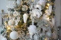 Christmas decorations on a fir tree close-up. Toys, cones, garlands with lights, balls, beads. New year, Royalty Free Stock Photo