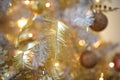 Christmas decorations on a fir tree close-up. Toys, cones, garlands with lights, balls, beads. New year, Royalty Free Stock Photo