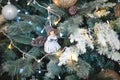 Christmas decorations on a fir tree close-up. Toys, cones, garlands with lights, balls, beads. New year, Royalty Free Stock Photo