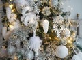 Christmas decorations on a fir tree close-up. Toys, cones, garlands with lights, balls, beads. New year, Royalty Free Stock Photo