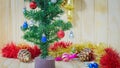 Christmas decorations focusing on red ball on pine tree