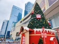 Christmas decorations in front of a large shopping mall with skyscrapers in the background in Shenzhen. Royalty Free Stock Photo