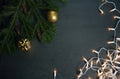 Christmas decorations with gift and lights on grey background Royalty Free Stock Photo