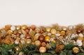 Christmas decorations Golden balls on spruce branches on a white background in large numbers.