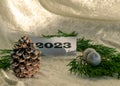 Christmas decorations, green needles, colorful ornaments, text 2023, Merry Christmas