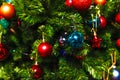 Christmas decorations hang on the tree with multi-colored glass balls Royalty Free Stock Photo