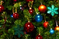 Christmas decorations hang on the tree with multi-colored glass balls Royalty Free Stock Photo