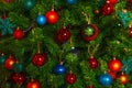 Christmas decorations hang on the tree with multi-colored glass balls Royalty Free Stock Photo