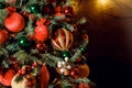 Christmas decorations on the holiday tree.Many colorful balls garland glowing lamps and red berries on the branches are Royalty Free Stock Photo