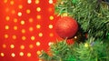 Christmas decorations hung on a Christmas tree against a red background Royalty Free Stock Photo