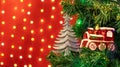 Christmas decorations hung on a Christmas tree against a red background Royalty Free Stock Photo