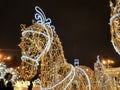 christmas decorations installed in the park in the form of a horse, glowing with lights Royalty Free Stock Photo