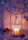 Christmas decorations and lantern at the evening . Focus on the wick candle Royalty Free Stock Photo