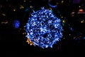 Christmas decorations with lights on a black background outside