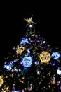 Christmas decorations with lights on a black background outside