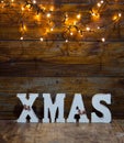 christmas decorations and lights on wooden background Royalty Free Stock Photo
