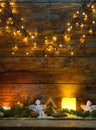 christmas decorations and lights on wooden background Royalty Free Stock Photo