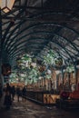 Christmas decorations, mistletoe and giant festive baubles in Covent Garden Market, London, UK