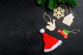 Christmas decorations and objects, wooden toys, top view flat lay, on black dark stone table background, with copy space for text Royalty Free Stock Photo