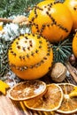 Christmas decorations and oranges on a wooden table