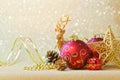 Christmas decorations over glitter sparkle background Royalty Free Stock Photo