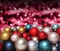 Christmas decorations, pile of glass colored balls isolated on blurred red bright lights, useful as a greeting gift card