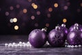 Christmas decorations with purple christmas balls and place for text
