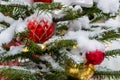 Christmas decorations. Real fir tree covered with snow. Christmas toy. Close-up Royalty Free Stock Photo