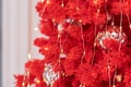 Christmas decorations on the red holiday tree. balls garland glowing lamps on the branches.Festive traditional seamless Royalty Free Stock Photo