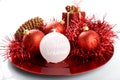 Christmas decorations on red plate Royalty Free Stock Photo