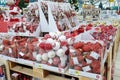 Christmas decorations, red and white colored balls, sells on a store counter. Festive shopping in mall